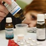 girl dripping drops into a glass